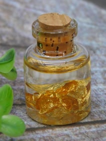 Small Glass Bottle With Gold Flakes and Cork Stopper