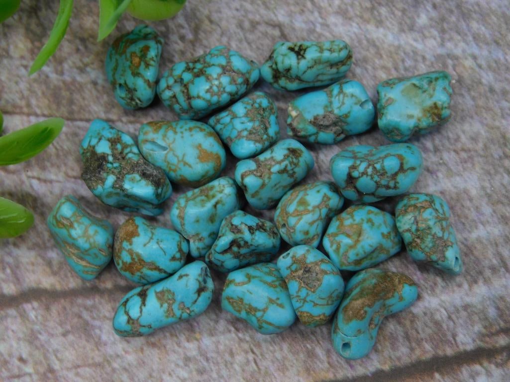 Small Tumbled Turquoise Gemstones Lot, 17 Grams: Lot of small tumbled turquoise gemstones with natural patterns and color variations. Total weight is 17 grams. Ideal for collectors, jewelry making, or crafting. Includes a variety of shapes and sizes