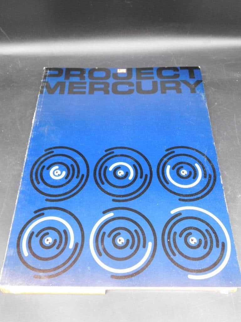 1964 Project Mercury Book Published by Time Inc.: Project Mercury book published in 1964 by Time Inc., featuring color and black-and-white images from LIFE magazine. Produced in arrangement with Simon and Schuster. Includes historical photos and capt