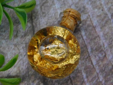 Small Glass Bottle With Gold Foil and Cork Stopper