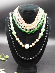 Collection of Multi-Strand Beaded Necklaces on Display