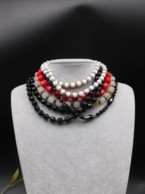 Set of Multi-Strand Beaded Bracelets in Red, Black, and White