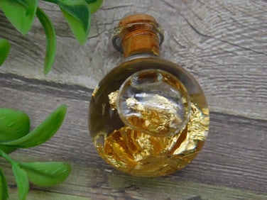 GOLD FLAKES IN BOTTLE ROCK STONE LAPIDARY SPECIMEN