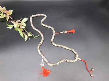 Beaded Necklace With Tassel Accents and Spiral Detailing