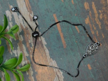 Adjustable Black-Tone Bracelet With Sparkling Teardrop Accent