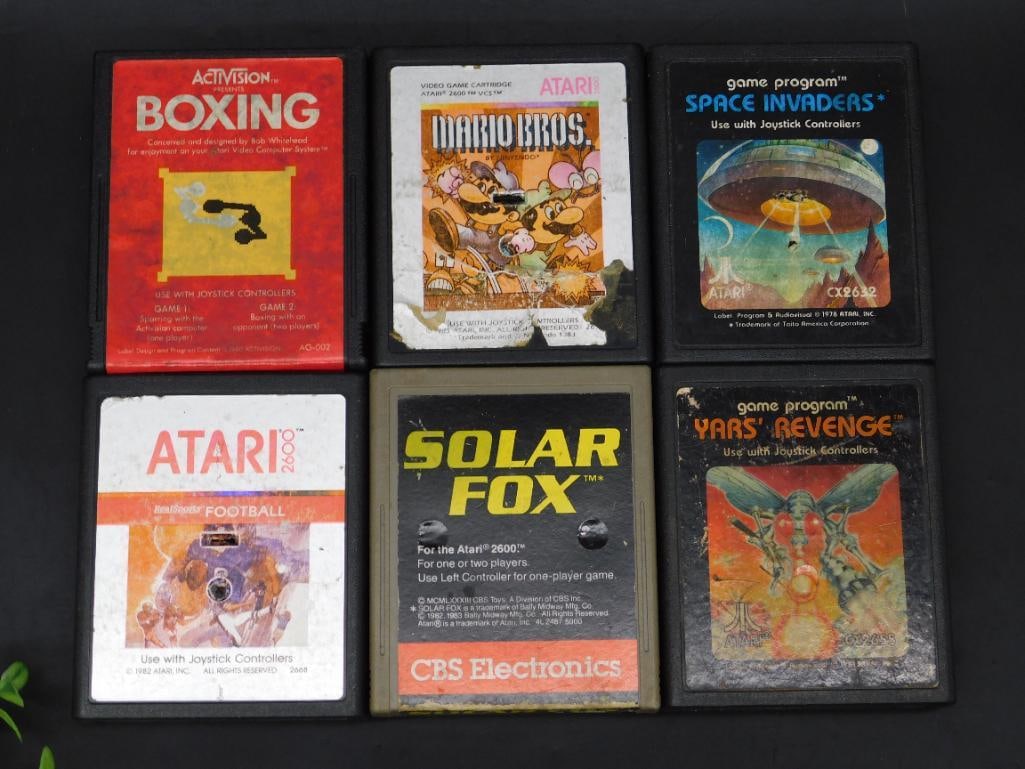 Lot of 6 Atari 2600 Video Game Cartridges: This lot includes six original Atari 2600 video game cartridges: Boxing (Activision), Donkey Kong (Atari), Space Invaders (Game Program), Football (Atari), Solar Fox (CBS Electronics), and Yar's Reven