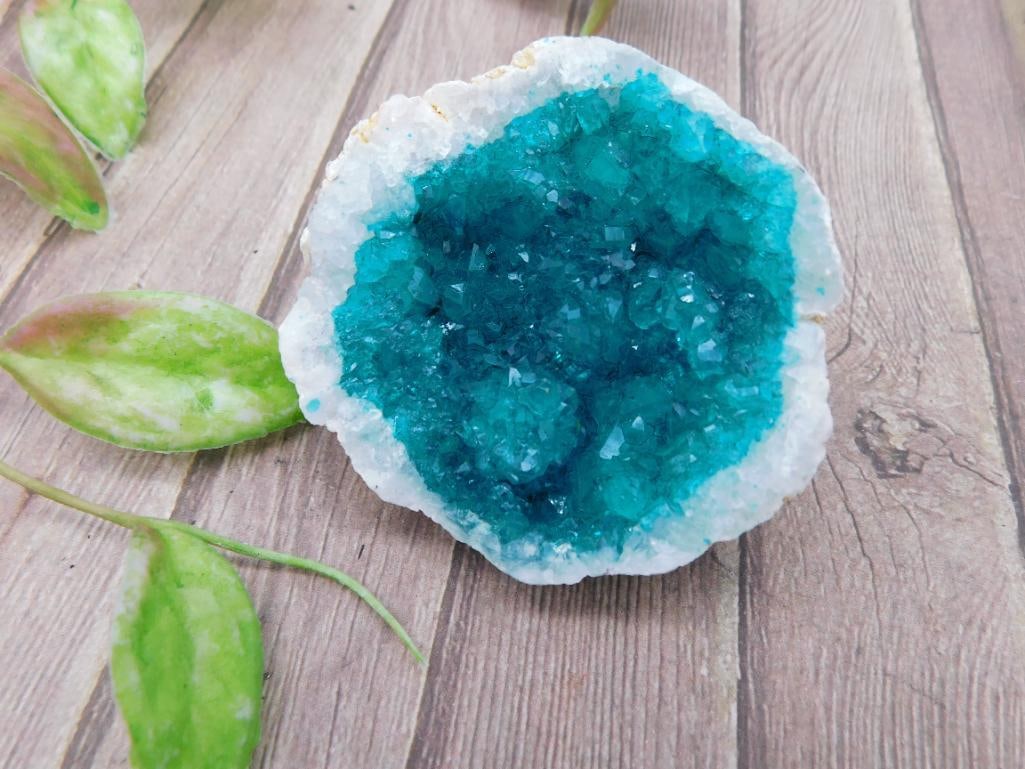 Blue Crystal Geode Specimen With Quartz Edges: Natural blue crystal geode specimen showcasing vibrant crystals within a quartz base. The geode displays a stunning contrast between the deep blue crystal interior and the lighter outer edges. Measure