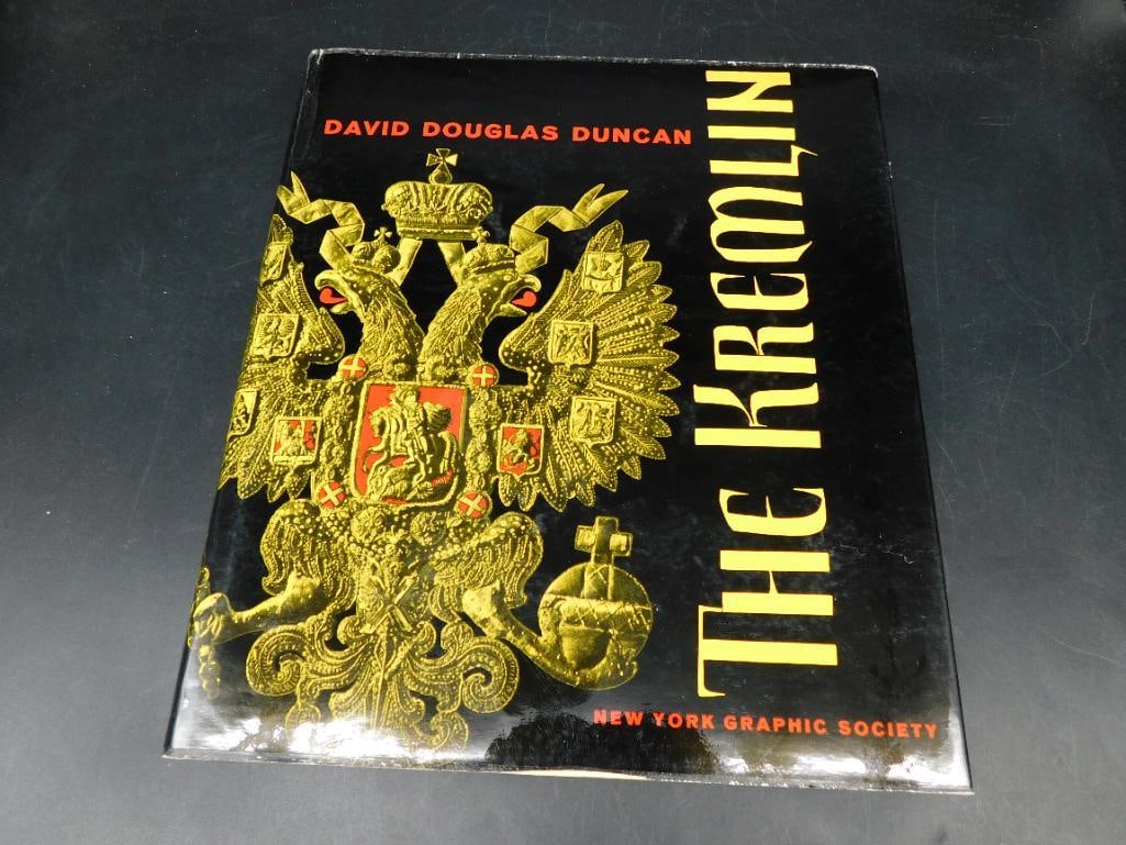 The Kremlin by David Douglas Duncan Hardcover Book: Hardcover copy of 'The Kremlin' by David Douglas Duncan. Published by the New York Graphic Society. Features a striking dust jacket with vibrant gold and black design. Printed in Switzerland, as noted