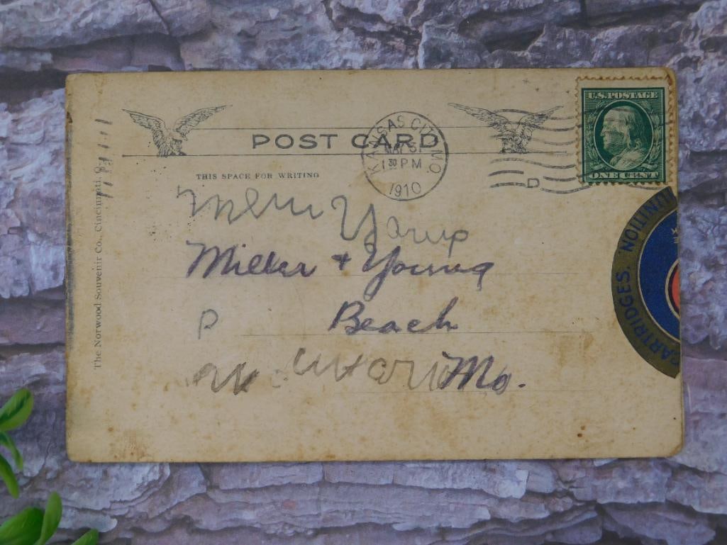 1910 Postcard With Train Illustration and Postmark: This is a 1910 postcard featuring a vibrant illustration of a train carrying 'Peters' labeled cars. The postcard has a Kansas City postmark and a green United States one-cent stamp. Addressed to 'Miss