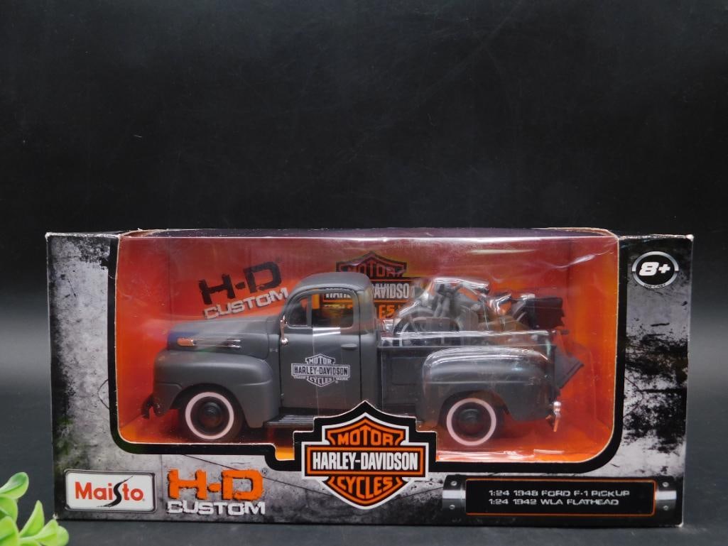 Maisto 1:24 Scale 1948 Ford F-1 Pickup with Harley-Davidson: Maisto 1:24 scale die-cast 1948 Ford F-1 Pickup truck. Features Harley-Davidson branding and detailing. Includes a model Harley-Davidson Flathead motorcycle in the truck bed. Packaged in an original c