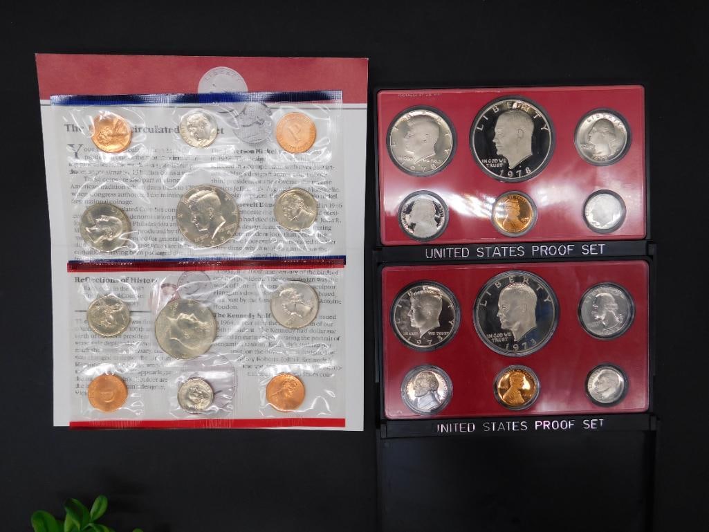 1974 and 2005 U.S. Mint Proof Coin Sets: Lot includes a 2005 U.S. Mint proof coin set in original packaging featuring coins such as the Kennedy half-dollar and state quarters. Also includes a 1974 U.S. Mint proof set with sealed coins, inclu