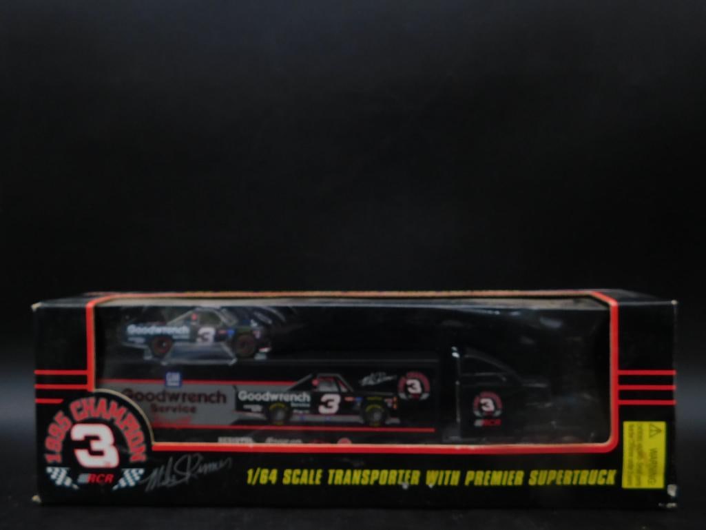 1985 Champion Goodwrench 1:64 Scale Transporter and Truck: 1985 Champion RCR 1:64 scale transporter with premier supertruck featuring Goodwrench Service design. Includes vibrant logos and details representing the 1985 championship. Boxed and unopened, with vi