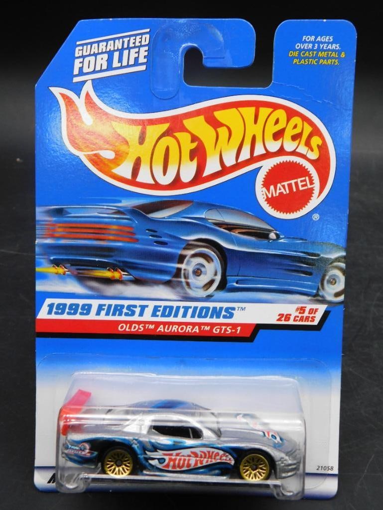 Hot Wheels 1999 First Editions Olds Aurora GTS-1 #5 of 26: Hot Wheels 1999 First Editions Olds Aurora GTS-1 die-cast car. Features vibrant packaging with 'Guaranteed for Life' notice, marked as #5 of 26 cars in the series. Collector number 911. Car in unopene