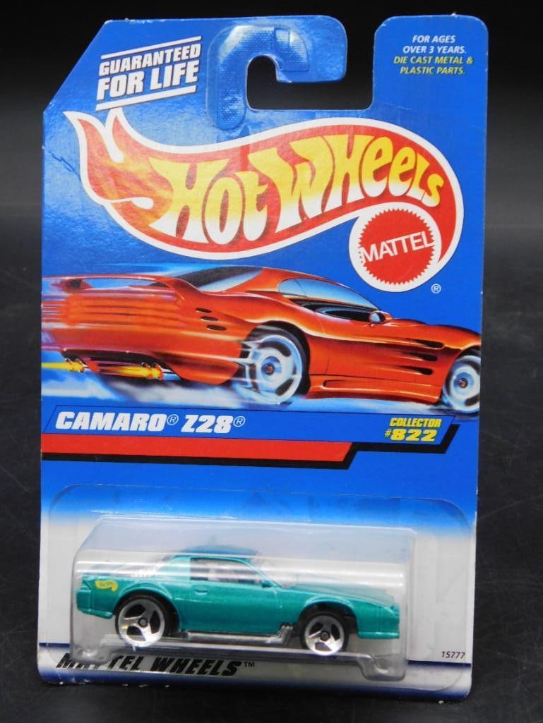 Hot Wheels Camaro Z28 Die-Cast Car in Original Packaging: Hot Wheels Camaro Z28 die-cast car, Collector #822, in its unopened original packaging. Manufactured by Mattel, this item is marked guaranteed for life and features a green vehicle replica. Includes b