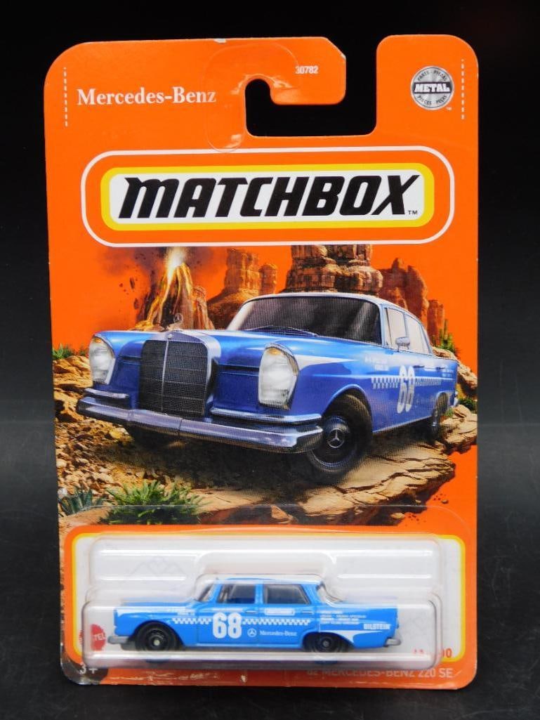 Matchbox ?62 Mercedes-Benz 220 SE, Carded, No. 68: Matchbox '62 Mercedes-Benz 220 SE die-cast vehicle, carded. Features a blue paint scheme with '68' detailing. Card is intact, showing minor wear. Part of Matchbox's collector series. Includes Mercedes
