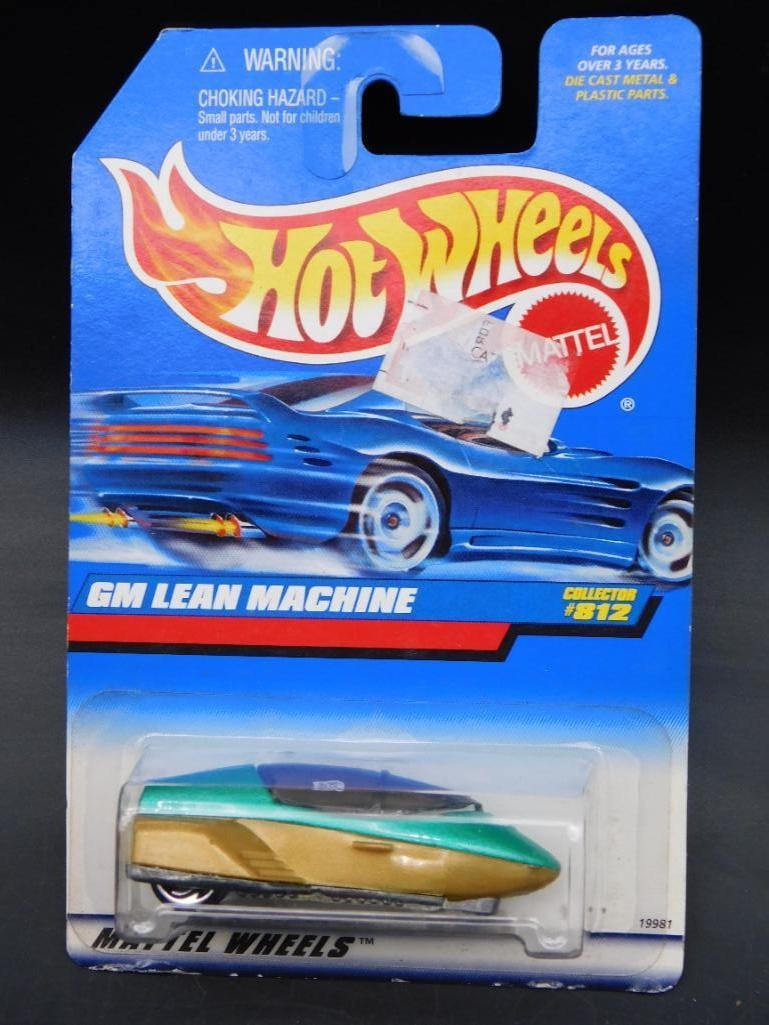 Hot Wheels GM Lean Machine Collector #812: Hot Wheels GM Lean Machine die-cast vehicle, Collector #812. Features blue packaging with clear bubble displaying the vehicle. Packaging includes detailed artwork and product information. Item remains