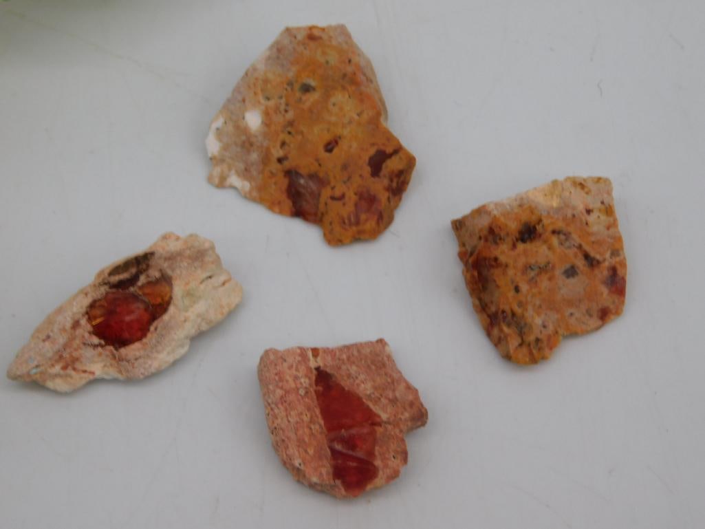 ROUGH OPALS ROCK STONE LAPIDARY SPECIMEN: Set Of Four Small Rocks With Red And Orange Hues, Varying Shapes And Textures. Ideal For Crafts, Collecting, Or Study. Includes A Ruler For Scale In The Image.