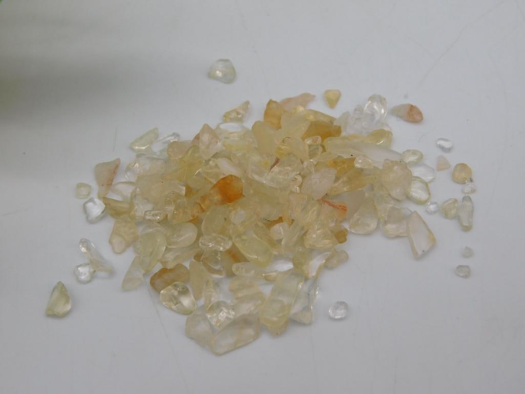 CITRINE ROCK STONE LAPIDARY SPECIMEN: This lot features small yellow and clear gemstones with a combined weight of 12 grams. The stones are uncut and vary in shades from clear to light yellow. Suitable for gem collectors, jewelry making, 