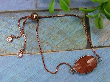 Adjustable Bracelet With Goldstone and Crystal Accents