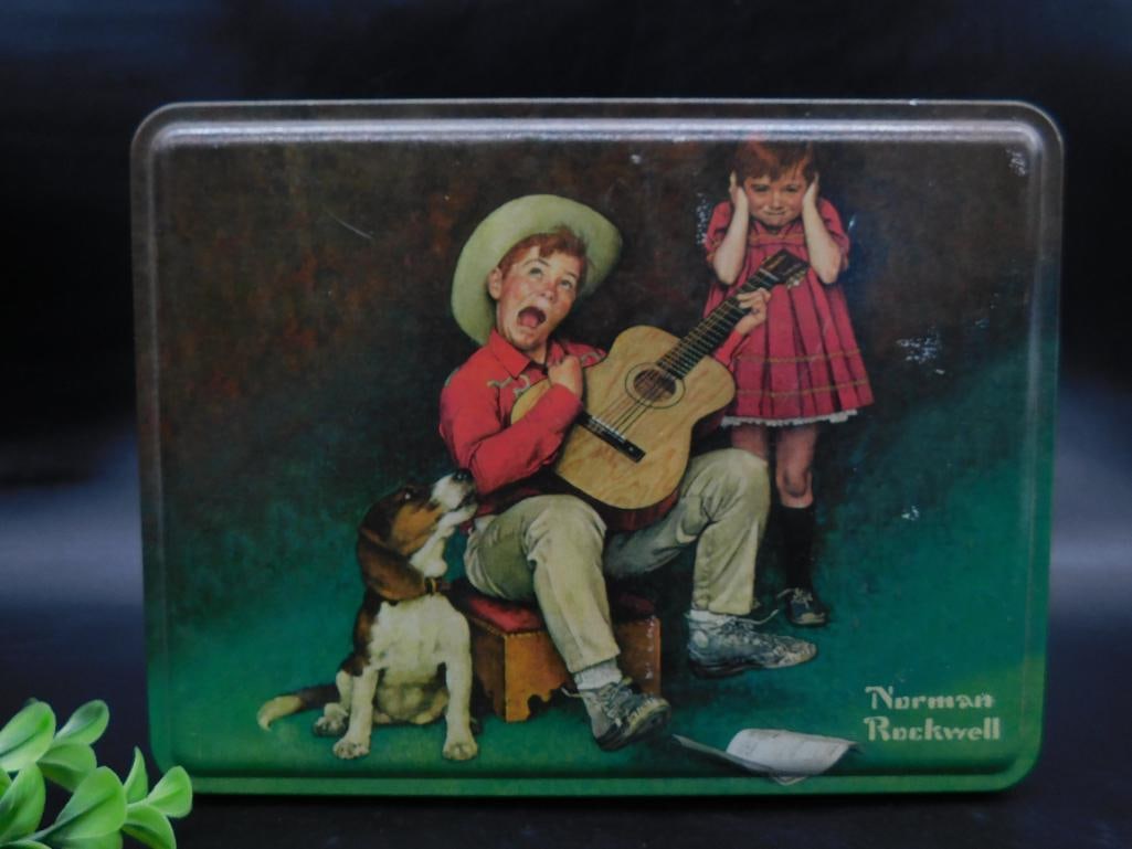 Norman Rockwell Tin With Musician Design: 2004 Collector?s Series tin featuring Norman Rockwell?s 'The Music Man' artwork, originally from Maurice Lenell cookies.