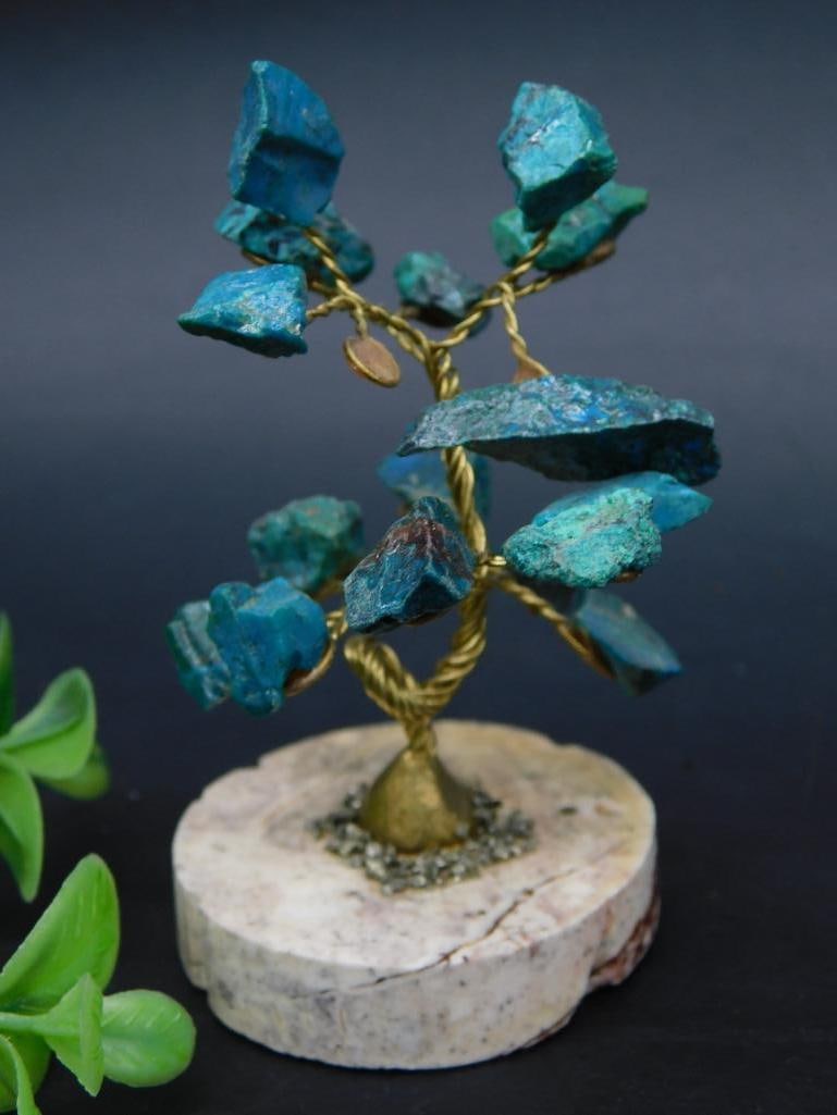 Brass Wire Bonsai Tree Sculpture With Stone Base: Brass wire bonsai tree sculpture featuring vibrant greenish-blue gemstones as leaves. Mounted on a smooth, round stone base for stability and aesthetic appeal. Measures approximately 41 grams in weigh