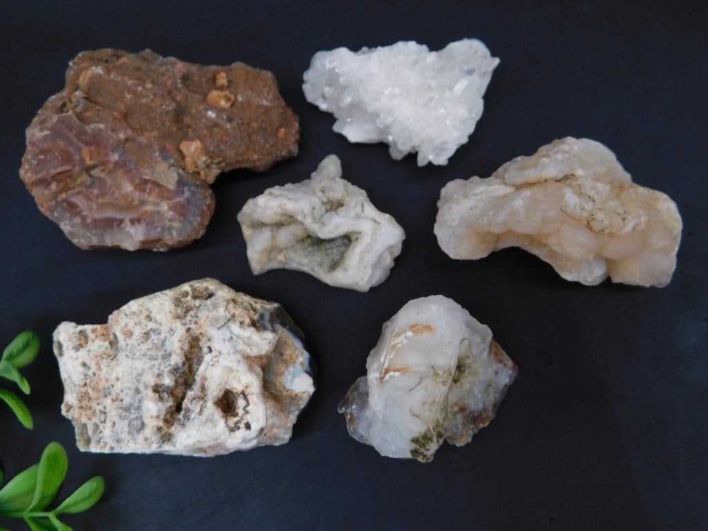 Collection of Mixed Mineral and Crystal Specimens: Includes six unique mineral and crystal specimens, featuring diverse textures and formations. Highlights include a clear crystal cluster and banded agate formation. Total weight is 338 grams as noted.