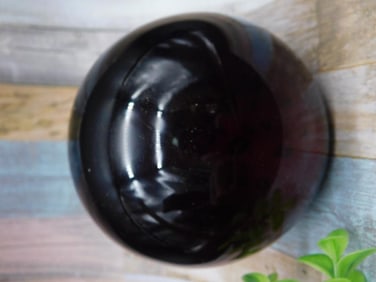 Black Glass Sphere With Encased Red and Yellow Designs