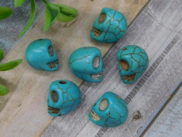 Set of Six Carved Turquoise-Like Skull Beads