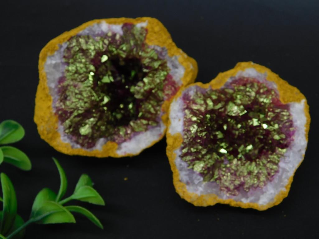 Pair of Druzy Quartz Geode Halves With Metallic Finish: A matching pair of natural Druzy Quartz geode halves featuring a metallic-like gold-colored finish. The geodes showcase vivid purple and white crystal formations surrounded by natural yellow-toned rou