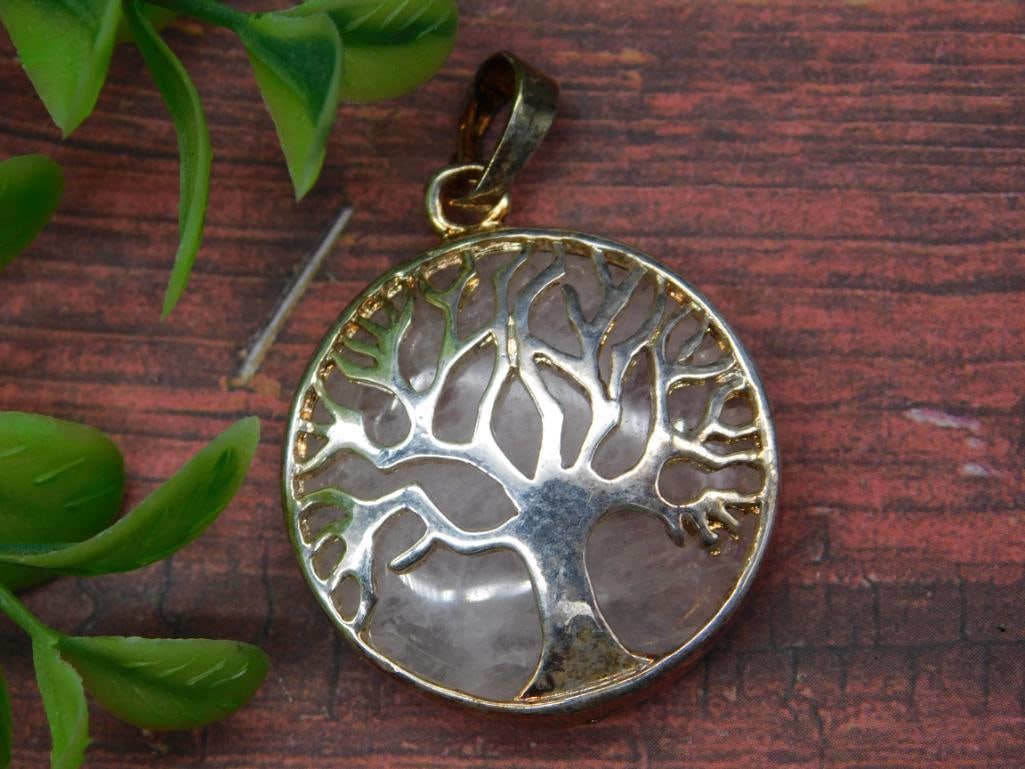 Round Tree of Life Pendant with Gold-Tone Frame: Tree of Life pendant featuring a gold-tone frame and tree design over a translucent background. Round-shaped design with attached gold-tone bail for chain compatibility. Ideal for pendants, necklaces,