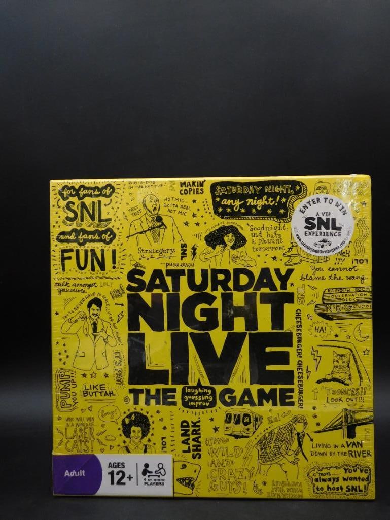Saturday Night Live: The Game Comedy Board Game: - Saturday Night Live: The Game, designed for ages 12 and up. | - Comes with SNL-themed content for interactive and creative gameplay. | - Includes components like cards, activity prompts, and a game