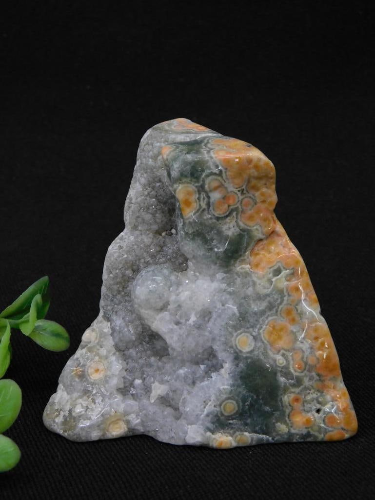 Ocean Jasper Specimen With Orange and Green Accents Rock Stone Lapidary Specimen: This unique polished agate specimen highlights natural patterns of orange and green with crystal formations visible within. It is presented standing upright, with dimensions indicated by the included