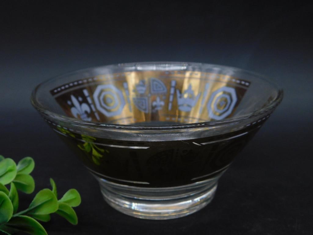 Glass Decorative Bowl With Etched Patterns: This glass bowl features intricate etched patterns on the exterior, providing an elegant design. Constructed from clear glass, it is smooth and polished, with a flared rim design. Ideal for display us