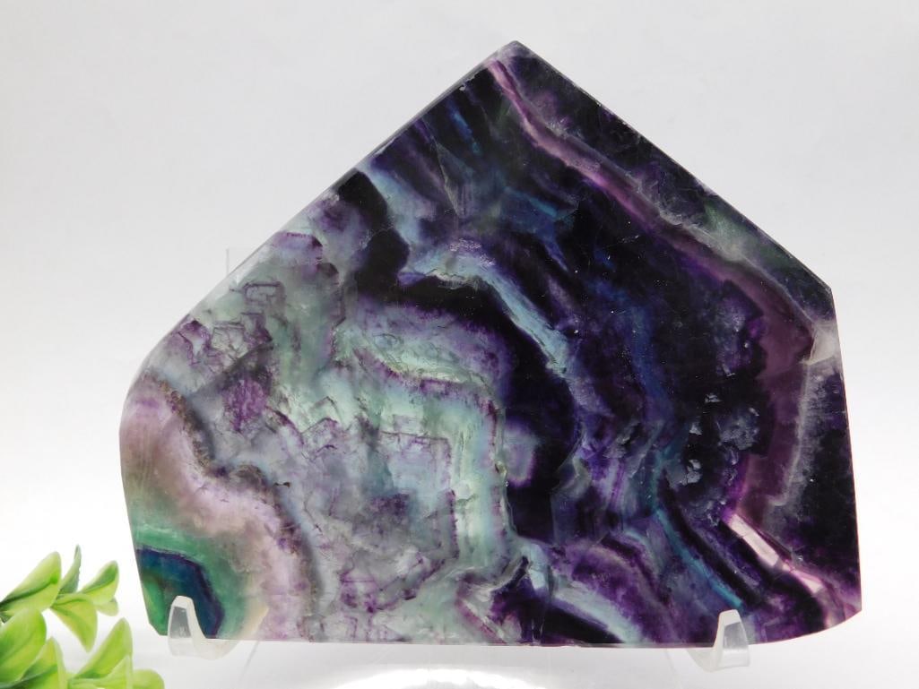 Polished Fluorite Slab With Multicolor Bands Rock Stone Lapidary Specimen: Polished fluorite slab featuring striking multicolor bands in shades of purple, green, and black. Weighs 339 grams as indicated. Displayed with natural details and patterns, suitable as a display piec