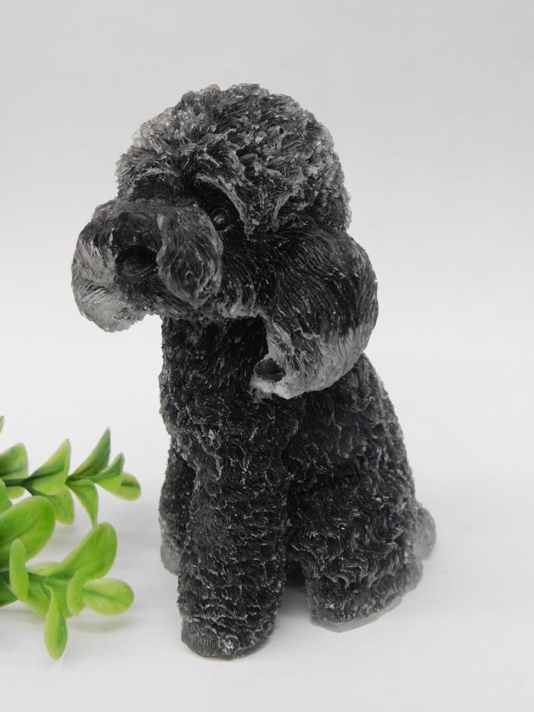 Carved Dark Stone Dog Figurine Rock Stone Lapidary Specimen: Carved dog figurine made of dark stone with a textured finish. The intricate details show the ears, and body. This solid stone figurine measures under 5 inches in height, as indicated by the ruler for