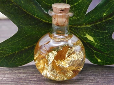 GOLD FLAKES IN BOTTLE ROCK STONE LAPIDARY SPECIMEN