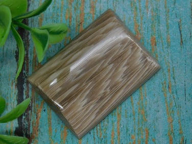 Cabochon Cut Stone With Inclusions