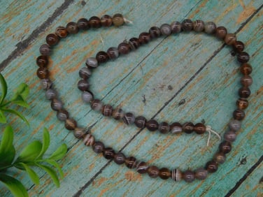 Strand of Brown Striped Agate Beads on String