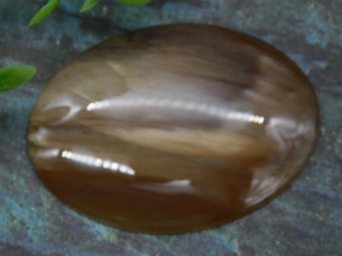 Polished Brown Oval Gemstone with Subtle Bands