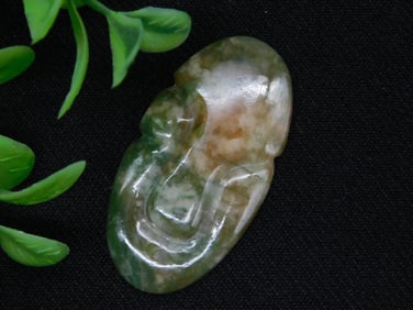 Green and Brown Carved Stone Pendant