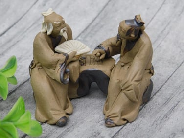 Ceramic Figurine Of Two Men Playing Board Game