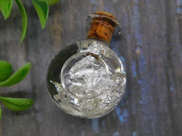SILVER FLAKES IN BOTTLE