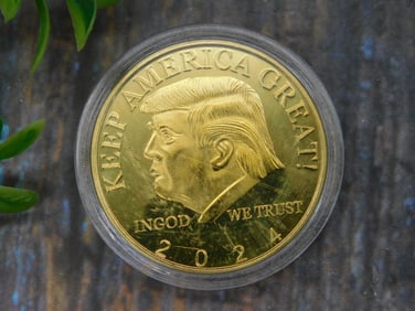 Gold-Colored Medallion Featuring Donald Trump Design