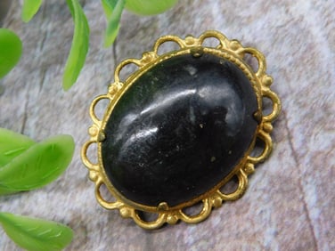 Gold-Tone Brooch with Green Oval Stone and Filigree Design