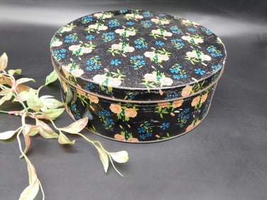 Round Metal Tin with Floral Pattern and Black Background