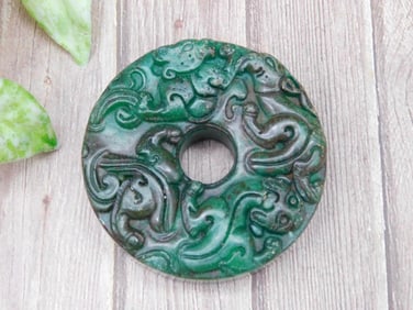 Circular Green Carved Jade with Intricate Patterns