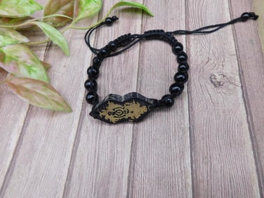 Adjustable Black Beaded Bracelet with Dragon Design Pendant