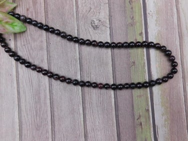 Dark Beaded Necklace With Garnet Spherical Beads