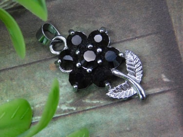 Silver-Tone Floral Pendant With Black Stone Accents