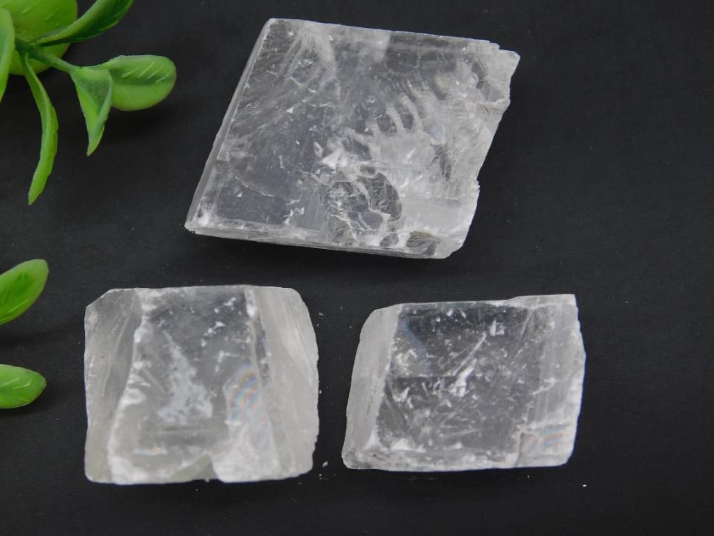 Icelandic Spar DOUBLE VISION Rock Stone Lapidary Specimen: A lot of three clear calcite mineral specimens with natural geometric formations. Each piece exhibits transparent qualities with visible inclusions and cleavage marks. Lot weighs 67 grams. Coin includ